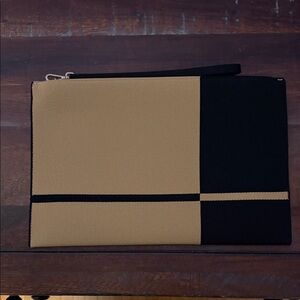 Rothy’s Black and Tan Clutch
